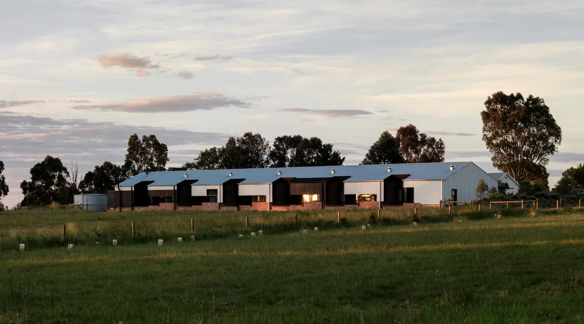 The guest suites at Brae at sunset, across open farmland